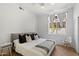 Bright bedroom with a ceiling fan, a large window, and neutral decor at 12055 E Clinton St, Scottsdale, AZ 85259