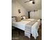 Bright bedroom features two twin beds, sloped ceiling, and minimalist design with a modern zebra head wall decor at 12055 E Clinton St, Scottsdale, AZ 85259