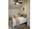 Charming bedroom featuring two twin beds, vaulted ceiling, and stylish decor, creating a cozy space at 12055 E Clinton St, Scottsdale, AZ 85259