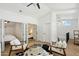 Bright open loft with plush seating, open bedroom views, and modern lighting at 12055 E Clinton St, Scottsdale, AZ 85259