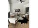Stylish loft space with modern furnishings, cowhide rug, and a comfortable workspace with natural light at 12055 E Clinton St, Scottsdale, AZ 85259