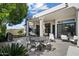 Outdoor patio with stylish furniture, a dining area, and a backyard view at 12055 E Clinton St, Scottsdale, AZ 85259