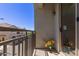 Apartment balcony features flower decorations, wrought iron railing and a street view at 1330 S Aaron -- # 218, Mesa, AZ 85209