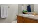 Bathroom features a single sink with wood cabinets, plus a mirror and towel rack on the wall at 1330 S Aaron -- # 218, Mesa, AZ 85209