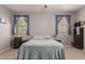 Cozy bedroom with two windows, neutral walls, and soft carpet flooring at 1330 S Aaron -- # 218, Mesa, AZ 85209