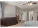 Bright bedroom features a ceiling fan, a bookshelf and two doors to other parts of the house at 1330 S Aaron -- # 218, Mesa, AZ 85209