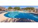 Community pool offers residents lounge seating, shade, and a pristine swimming environment at 1330 S Aaron -- # 218, Mesa, AZ 85209