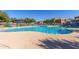 Community pool featuring lounge chairs and a covered picnic area for residents to enjoy at 1330 S Aaron -- # 218, Mesa, AZ 85209