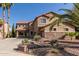 Inviting two-story home featuring desert landscaping, and a large driveway, perfect for multiple vehicles at 13514 W Banff Ln, Surprise, AZ 85379