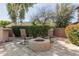 Cozy outdoor fire pit area with comfortable seating and manicured landscaping at 13514 W Banff Ln, Surprise, AZ 85379