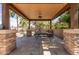 Comfortable poolside gazebo featuring a ceiling fan and relaxing porch swing at 13514 W Banff Ln, Surprise, AZ 85379