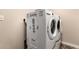 Modern laundry room with washer and dryer and inspirational decor at 13514 W Banff Ln, Surprise, AZ 85379