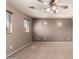 Living room featuring natural light from windows, and neutral color walls and carpet at 13514 W Banff Ln, Surprise, AZ 85379