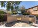 Well-equipped outdoor kitchen area with built-in grill, sink, and stainless-steel refrigerator at 13514 W Banff Ln, Surprise, AZ 85379