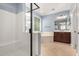 Bathroom with a shower, tub and double sinks at 1437 E Flamingo Way, Gilbert, AZ 85297