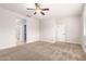 Bedroom with neutral walls, carpeted floor, ceiling fan and white trim at 1437 E Flamingo Way, Gilbert, AZ 85297