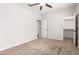 Bedroom featuring neutral carpet, a ceiling fan and a closet at 1437 E Flamingo Way, Gilbert, AZ 85297