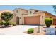 Charming single-story home featuring a desert landscape, tile roof, and a spacious two-car garage, offering a great curb appeal at 1437 E Flamingo Way, Gilbert, AZ 85297
