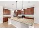 Modern kitchen with stainless steel appliances, granite countertops, and ample cabinet space at 1437 E Flamingo Way, Gilbert, AZ 85297