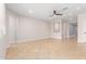 Bright, open living room with neutral walls and tile floors, and a ceiling fan at 1437 E Flamingo Way, Gilbert, AZ 85297