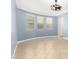 A room with a curved wall, tile floor and modern light fixture at 1437 E Flamingo Way, Gilbert, AZ 85297