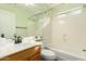 Bathroom features a tub and shower combo with a oak vanity at 1439 S Dodge St, Gilbert, AZ 85233