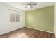 Neutral bedroom with hardwood floors and ceiling fan at 1439 S Dodge St, Gilbert, AZ 85233