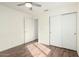 Bedroom with hardwood floors and sliding closet doors at 1439 S Dodge St, Gilbert, AZ 85233