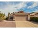 Charming single-story home featuring a two-car garage, tile roof, and well-maintained landscaping at 1439 S Dodge St, Gilbert, AZ 85233
