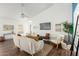 Stylish living room boasting high ceilings, a ceiling fan, and wood-look flooring at 1439 S Dodge St, Gilbert, AZ 85233
