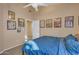 Bedroom with travel posters, a ceiling fan, and a comfortable bed at 15206 S 47Th St, Phoenix, AZ 85044