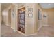 Hallway featuring built in bookcase with display lighting and artwork at 15206 S 47Th St, Phoenix, AZ 85044