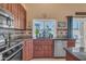 Well-equipped kitchen showcasing updated cabinets, stainless appliances, and backyard view at 15206 S 47Th St, Phoenix, AZ 85044