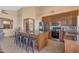 Spacious kitchen includes a large center island, stainless appliances, and bar stool seating at 15206 S 47Th St, Phoenix, AZ 85044
