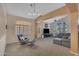 Comfortable living space with modern furnishings, a ceiling fan, and large windows with shutters at 15206 S 47Th St, Phoenix, AZ 85044