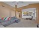 Open living area with cozy seating, seamless flow to other living spaces and neutral carpeting at 15206 S 47Th St, Phoenix, AZ 85044