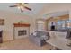 Comfortable living room featuring a fireplace and an open floor plan to the dining area at 15206 S 47Th St, Phoenix, AZ 85044