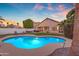 Inviting backyard pool with lounge seating and ample space for outdoor entertainment at sunset at 15206 S 47Th St, Phoenix, AZ 85044