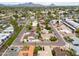 An aerial view showcases the charming neighborhood with mountain views and well-maintained landscaping at 1523 W Glenn Dr, Phoenix, AZ 85021