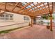 Relaxing backyard with a pergola-covered patio and refreshing swimming pool at 1523 W Glenn Dr, Phoenix, AZ 85021