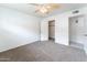 Spacious bedroom with neutral walls, carpet flooring, and a closet at 1523 W Glenn Dr, Phoenix, AZ 85021