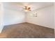 Bright and airy bedroom with neutral carpet and ample space for customization at 1523 W Glenn Dr, Phoenix, AZ 85021