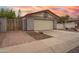 Charming home exterior featuring a two-car garage and basketball hoop at 1523 W Glenn Dr, Phoenix, AZ 85021