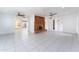 Spacious living room boasting bright interiors, tile flooring, and a brick fireplace at 1523 W Glenn Dr, Phoenix, AZ 85021