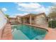 A private pool is surrounded by a safety fence, creating a safe and enjoyable outdoor space at 1523 W Glenn Dr, Phoenix, AZ 85021