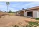 Large backyard area with shed and covered patio, surrounded by a block fence at 16010 N 47Th Dr, Glendale, AZ 85306