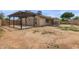Large backyard featuring a covered patio and pergola, perfect for outdoor living at 16010 N 47Th Dr, Glendale, AZ 85306