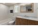Bright bathroom with modern fixtures, granite counters, and a shower-tub combo at 16010 N 47Th Dr, Glendale, AZ 85306