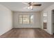 Spacious bedroom offering a ceiling fan and a large bright window at 16010 N 47Th Dr, Glendale, AZ 85306