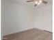 Bright bedroom with a ceiling fan and modern laminate flooring at 16010 N 47Th Dr, Glendale, AZ 85306